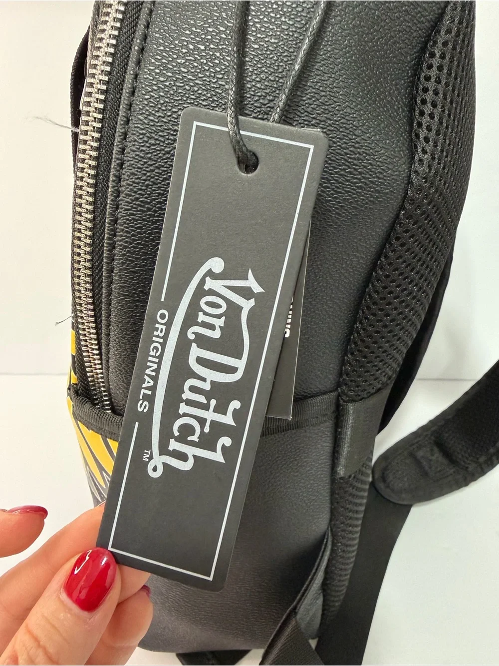 Von Dutch Black Backpack with Yellow Winged Eyeball and Blue Iris